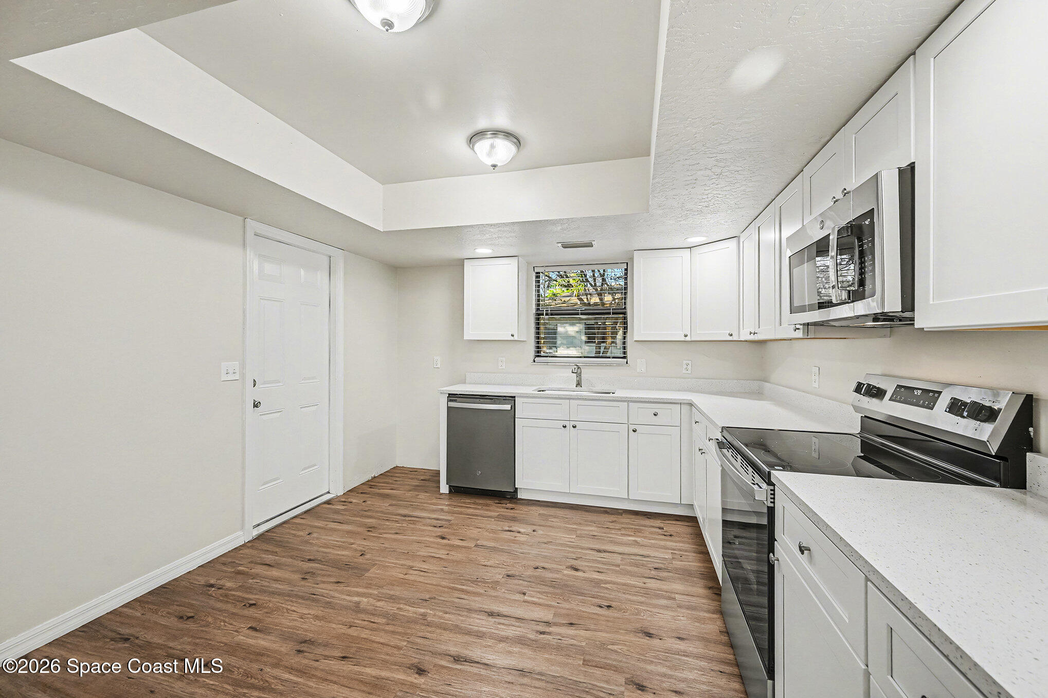 110 Cardinal Drive Sebastian, FL 32958 - Photo 10 of 23 a kitchen with a sink cabinets and wooden floor