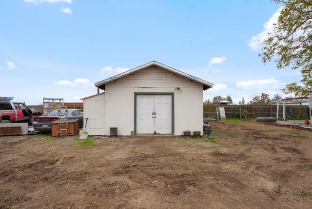 a view of a swimming pool with an outdoor space and seating area