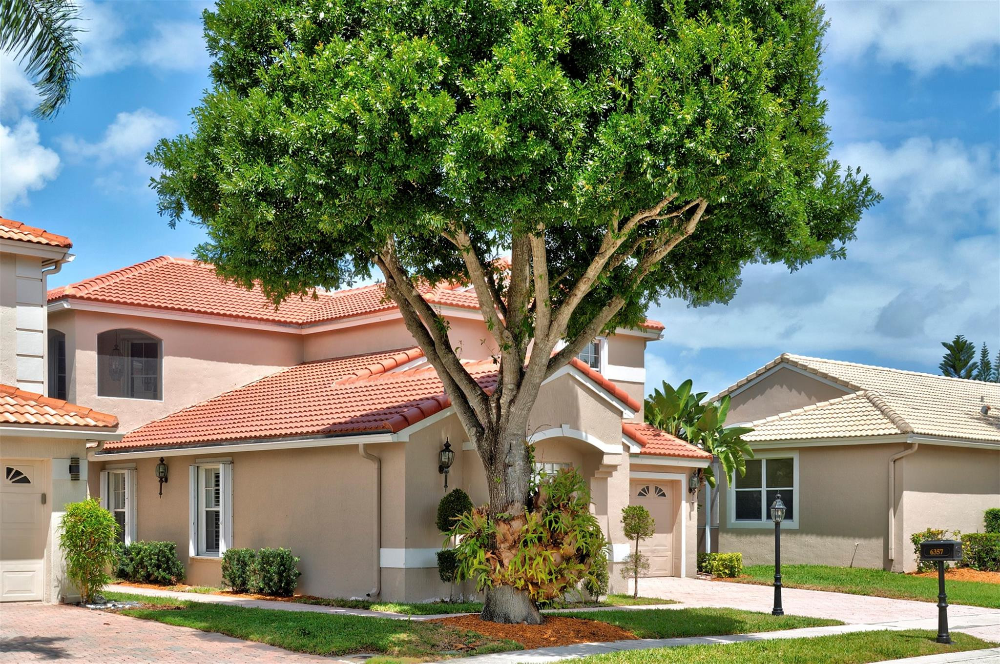 6357 Brava Way Boca Raton, FL 33433 - Photo 15 of 73 a front view of a house with a yard