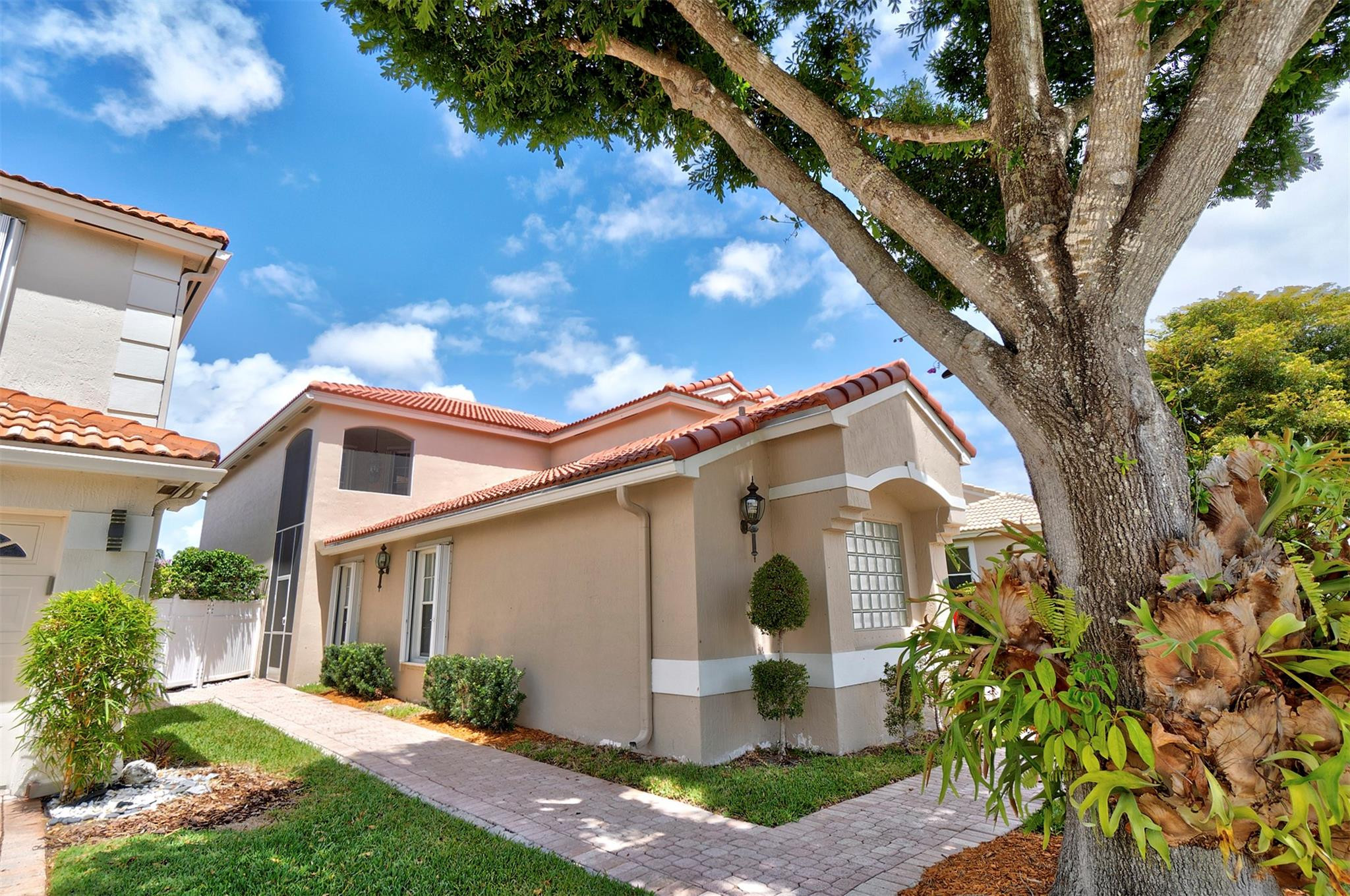 6357 Brava Way Boca Raton, FL 33433 - Photo 18 of 73 a front view of a house with garden