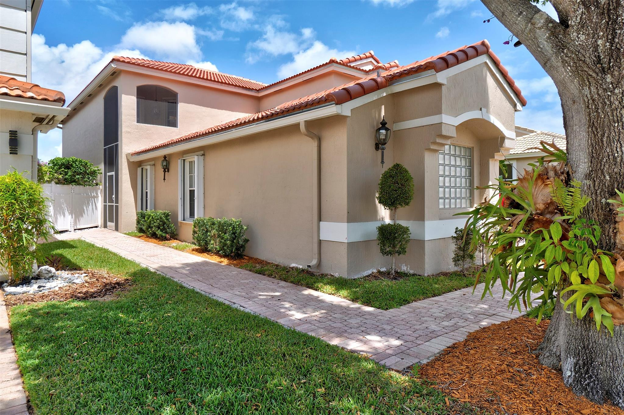 6357 Brava Way Boca Raton, FL 33433 - Photo 19 of 73 a front view of a house with garden