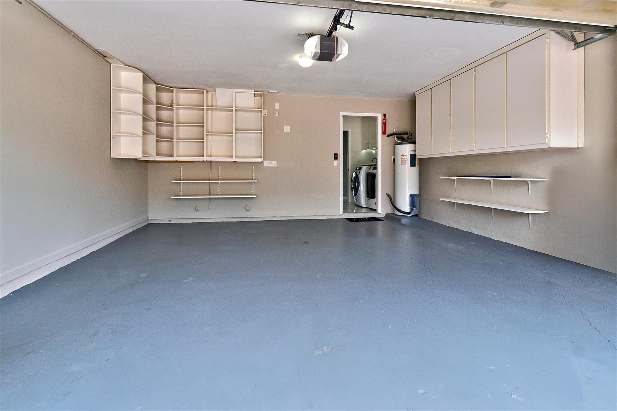 6357 Brava Way Boca Raton, FL 33433 - Photo 21 of 73 an empty room with windows and cabinet