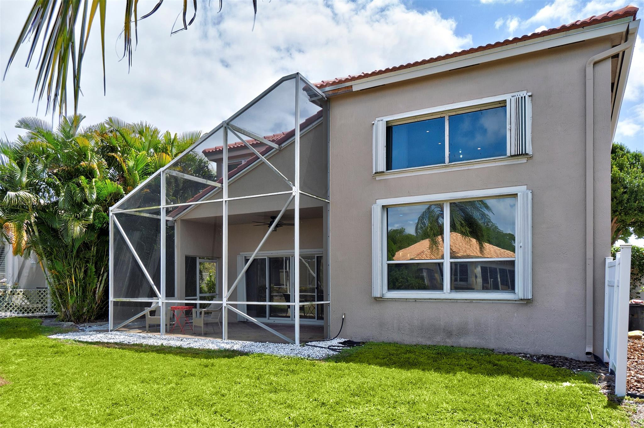 6357 Brava Way Boca Raton, FL 33433 - Photo 25 of 73 a front view of a house with a yard