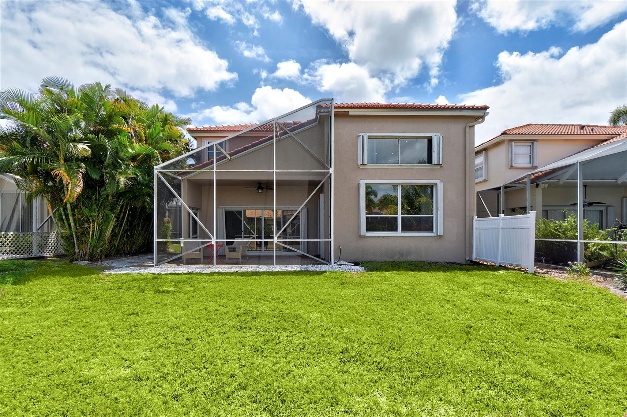 6357 Brava Way Boca Raton, FL 33433 - Photo 26 of 73 a view of a house with a yard and sitting area