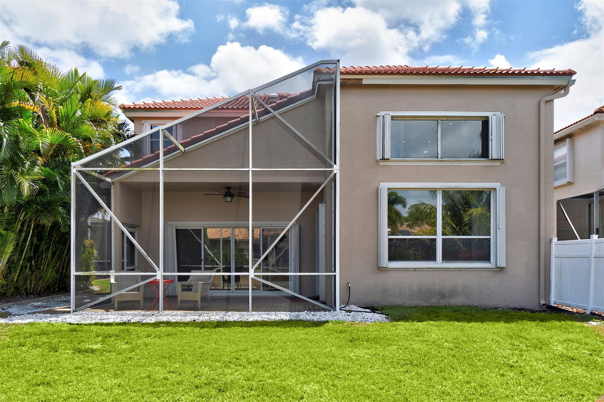 6357 Brava Way Boca Raton, FL 33433 - Photo 27 of 73 a view of a house with a yard and a large tree