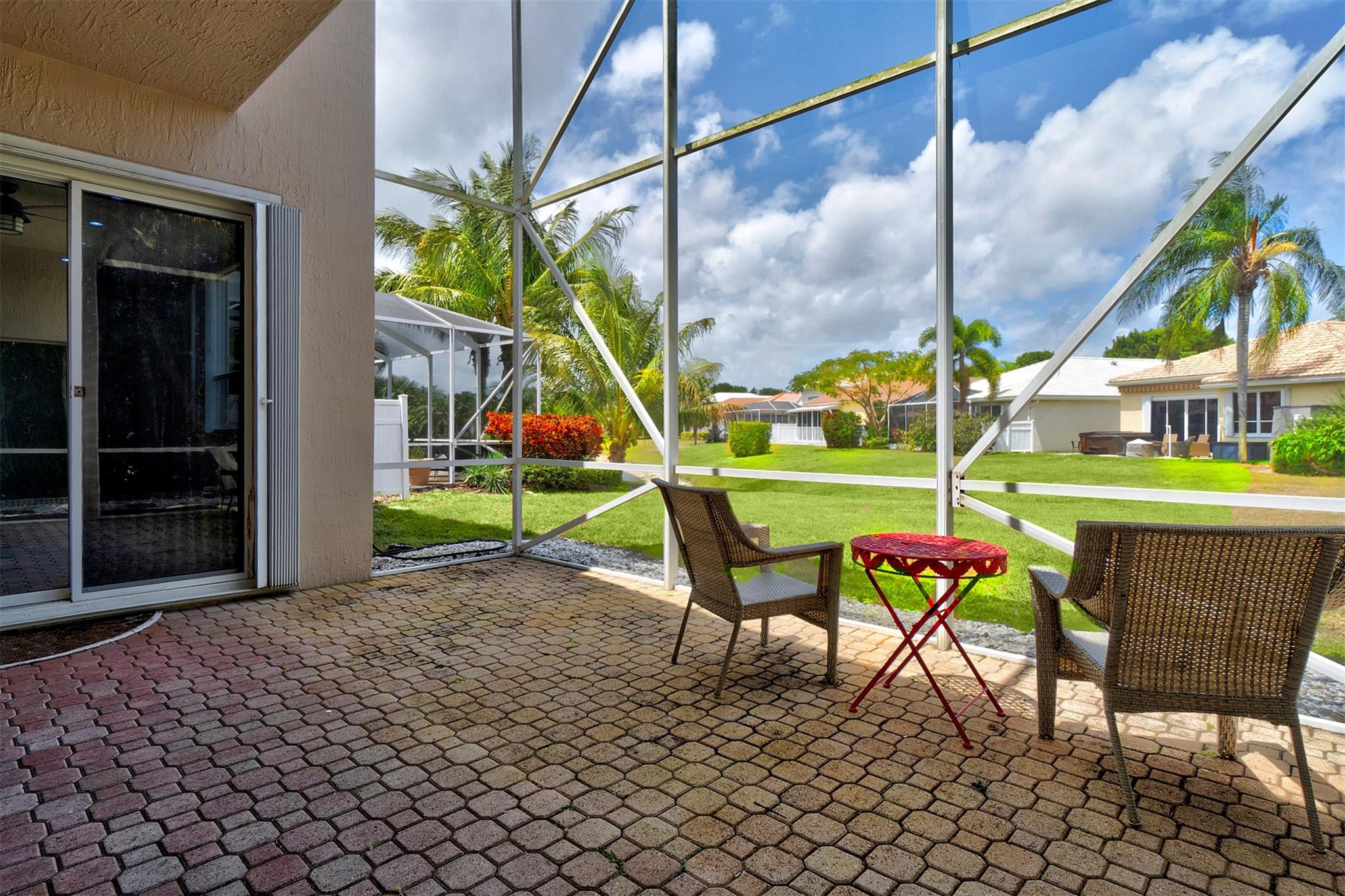 6357 Brava Way Boca Raton, FL 33433 - Photo 31 of 73 a chair and table sitting in front of a building