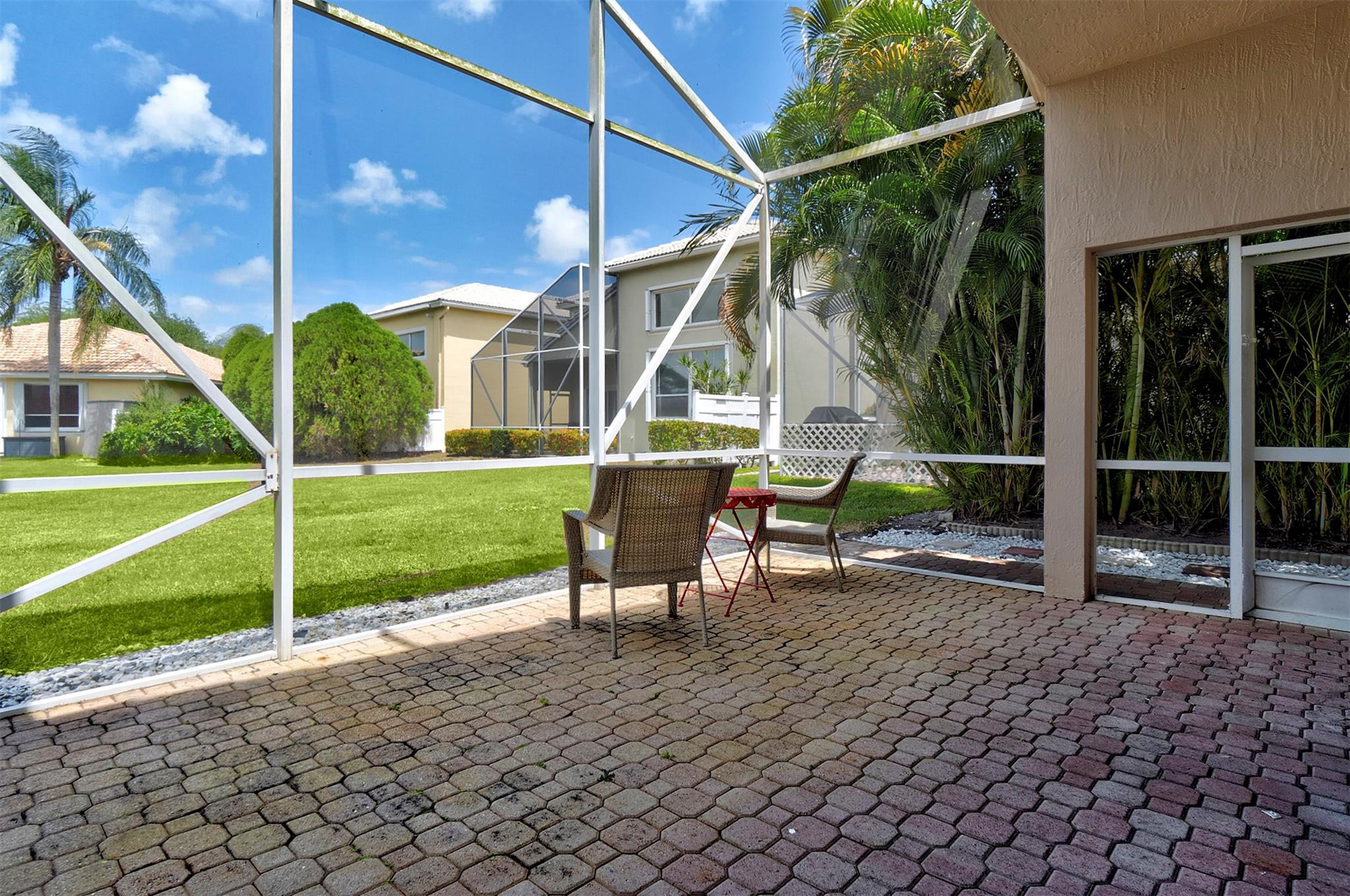 6357 Brava Way Boca Raton, FL 33433 - Photo 32 of 73 a view of a house with backyard porch and sitting area