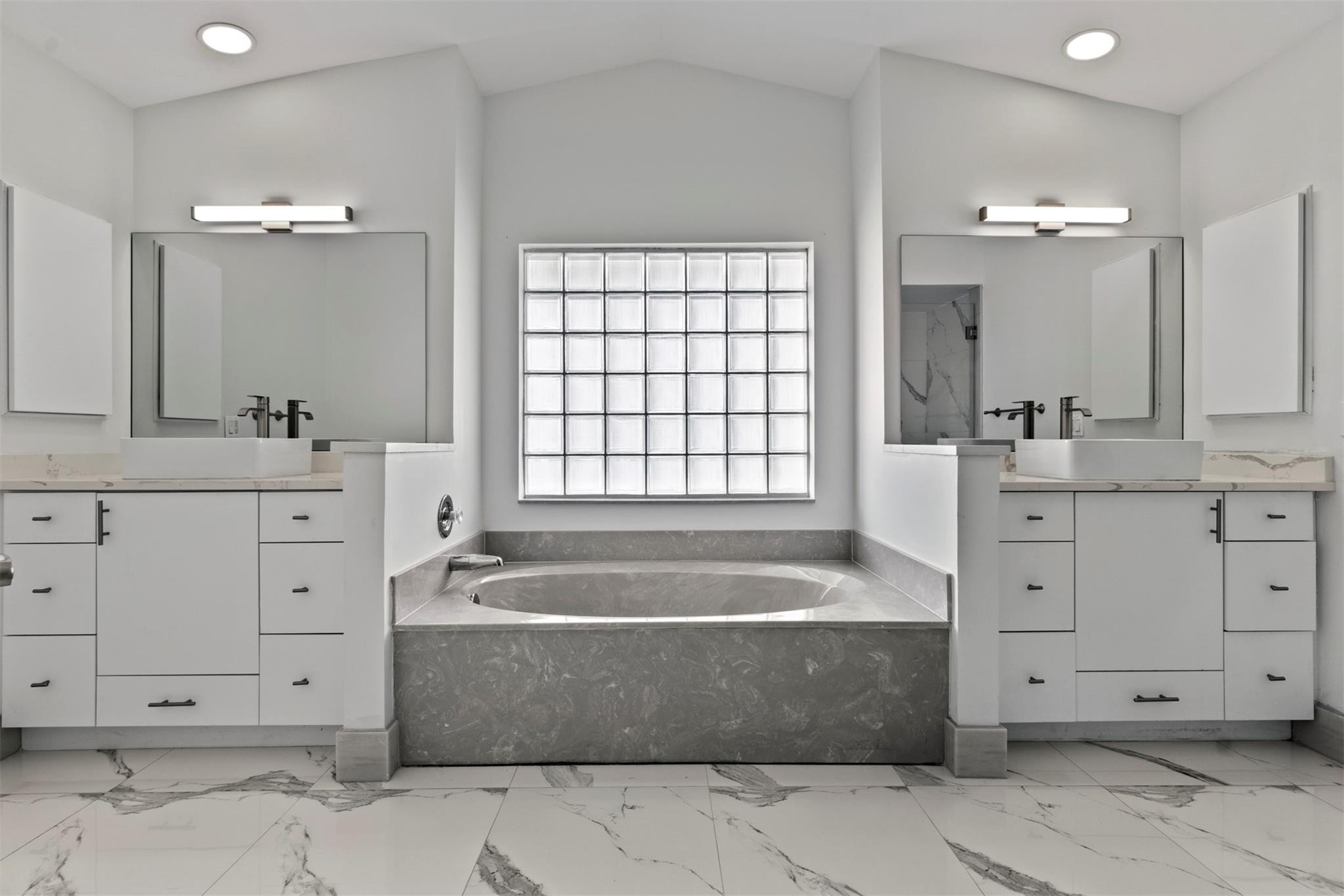 6357 Brava Way Boca Raton, FL 33433 - Photo 56 of 73 a spacious bathroom with a tub sink and mirror