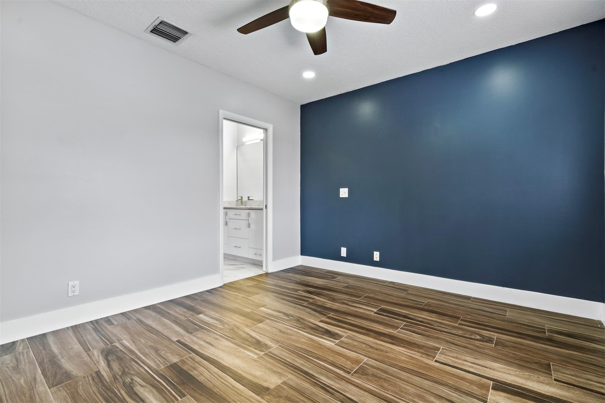 6357 Brava Way Boca Raton, FL 33433 - Photo 62 of 73 a view of empty room with wooden floor