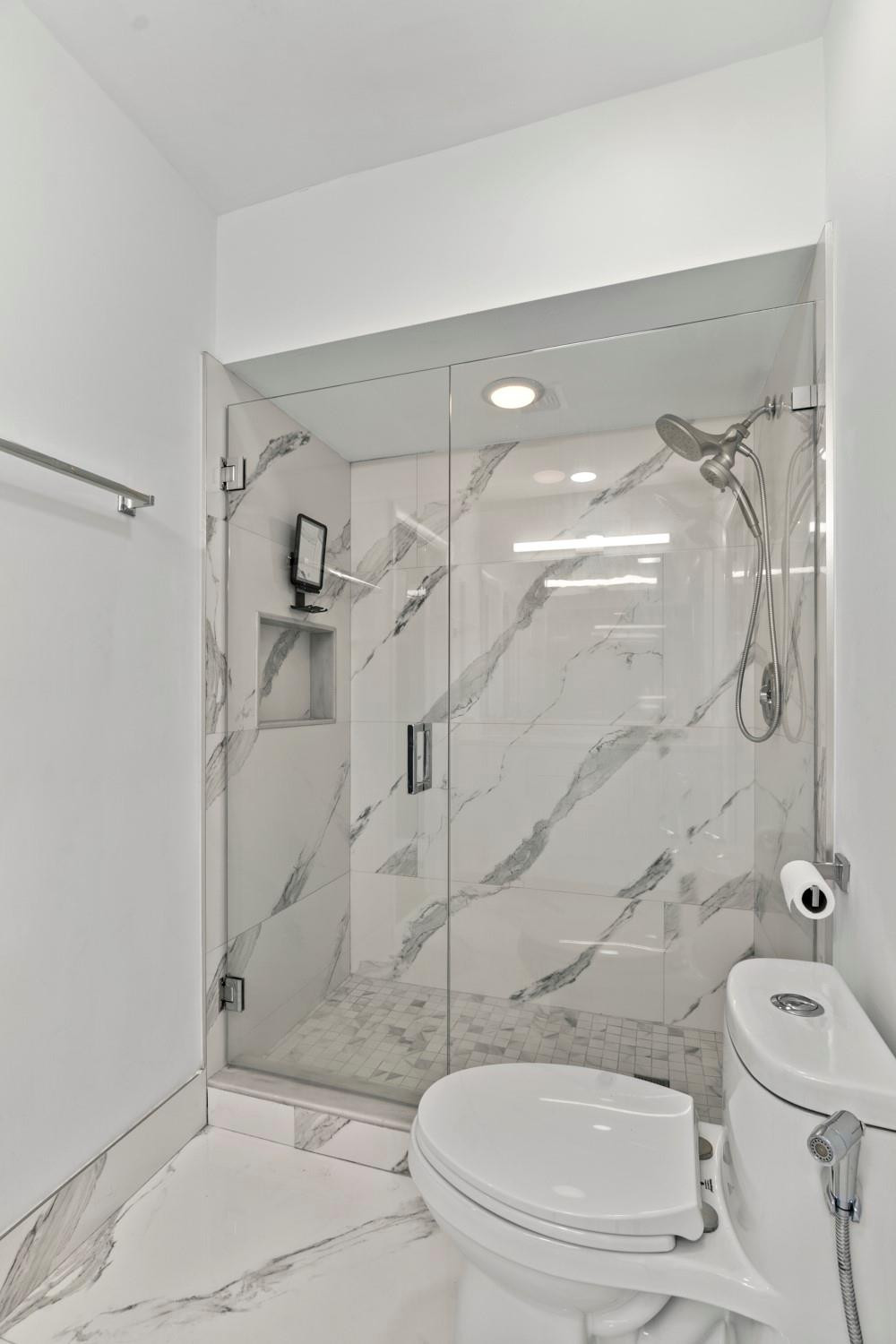 6357 Brava Way Boca Raton, FL 33433 - Photo 65 of 73 a bathroom with a toilet and shower