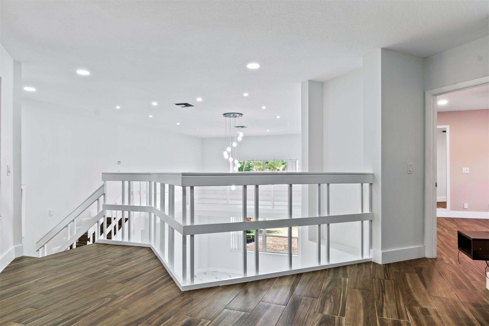 6357 Brava Way Boca Raton, FL 33433 - Photo 70 of 73 a view of hallway with wooden floor