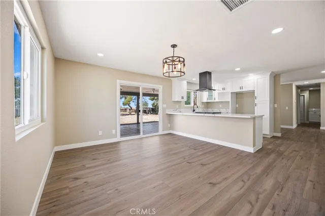 a view of kitchen with wooden floor and window