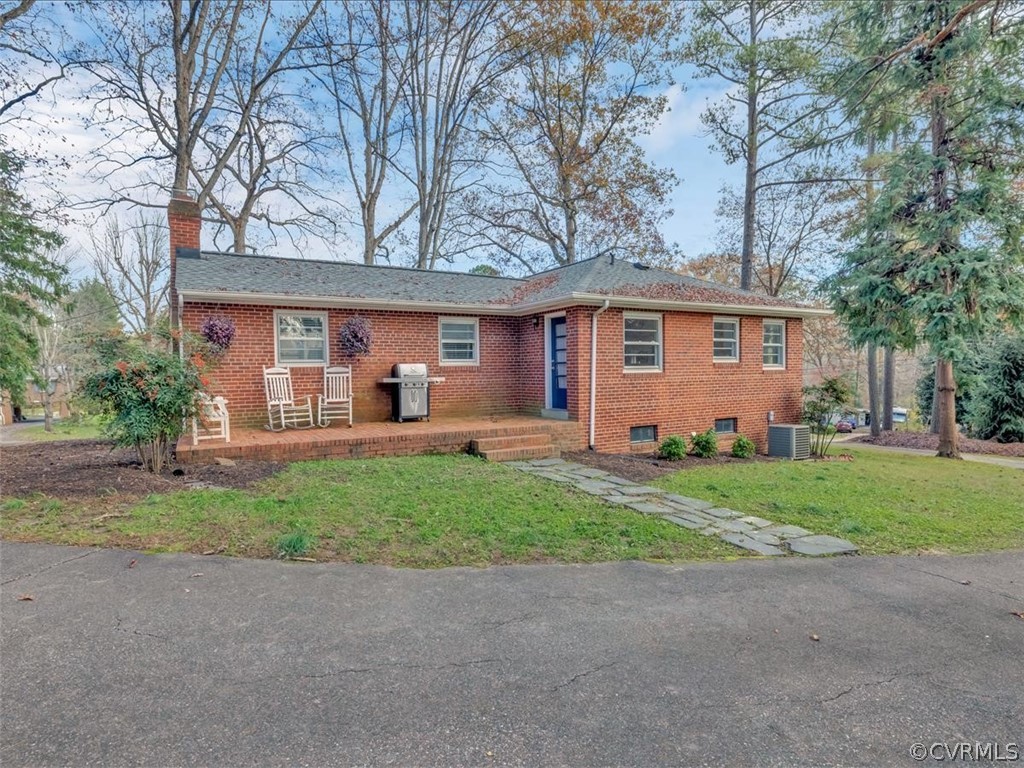 4232 Randolph Road Chesterfield, VA 23236 - Photo 29 of 31 Rear of house with brick patio deck and sidewalk