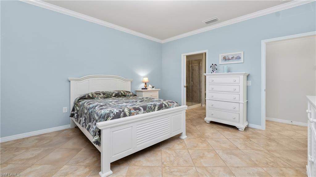 5113 Da Vinci Way Ave Maria, FL 34142 - Photo 11 of 31 a bedroom with a bed and furniture