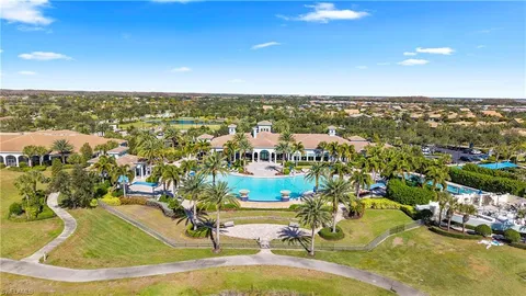 an aerial view of swimming pool patio and mountain view