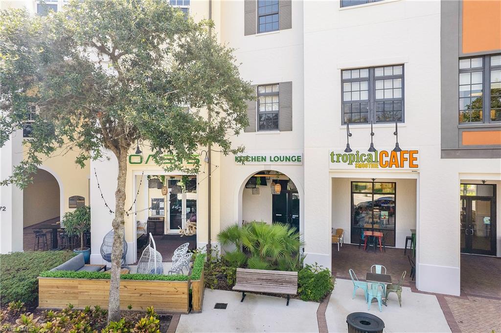 5113 Da Vinci Way Ave Maria, FL 34142 - Photo 31 of 31 a front view of a house with a garden and plants