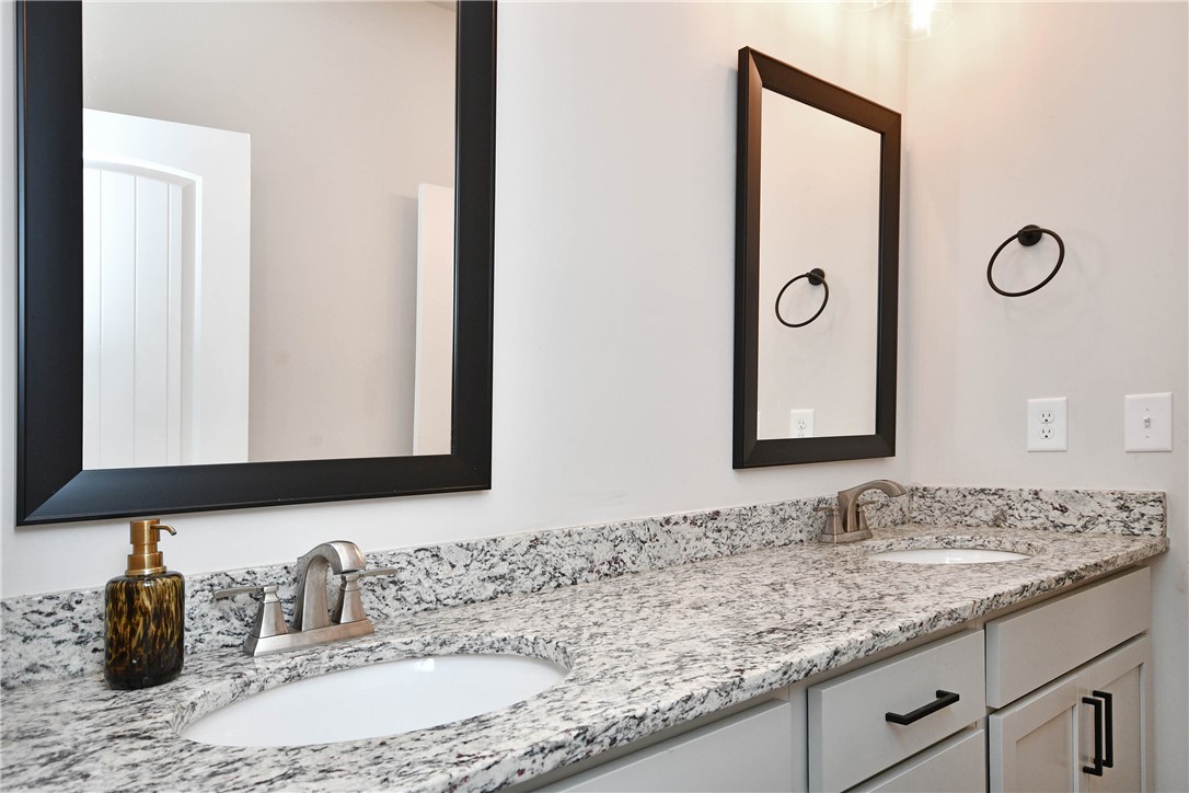 3131 Lullwater Drive Anderson, SC 29624 - Photo 17 of 31 This bright bathroom features dual vanities, framed mirrors, and ample storage for a refreshed daily routine.
