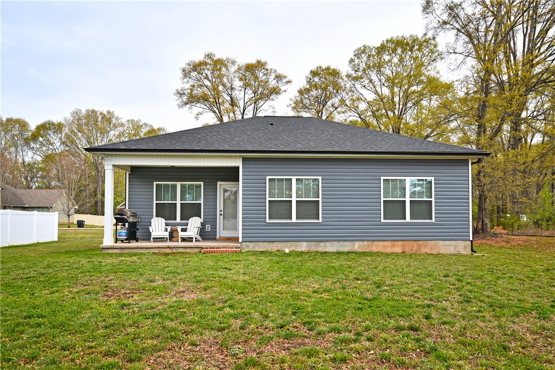 3131 Lullwater Drive Anderson, SC 29624 - Photo 22 of 31 This residence offers a tranquil outdoor retreat with a spacious yard and covered patio perfect for relaxation.