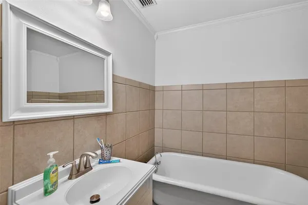 a bathroom with a sink and bathtub