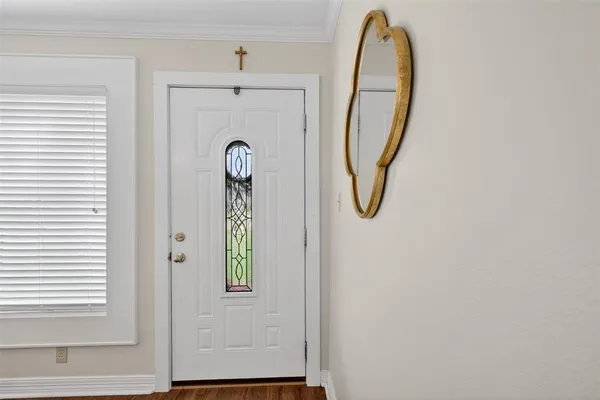 a view of a hallway with windows