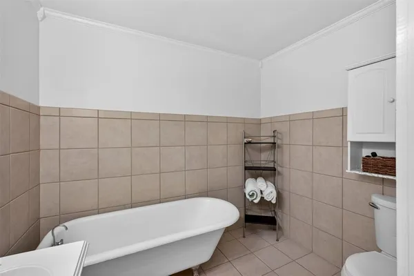 a bathroom with a bathtub and shower