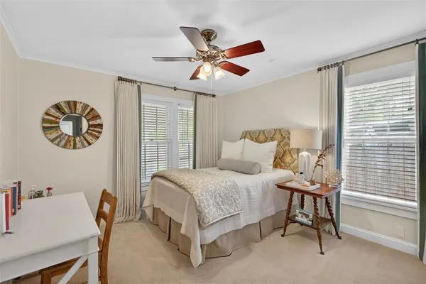 a bedroom with a bed and a desk