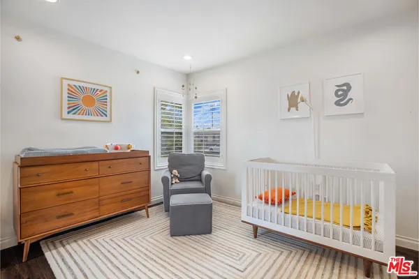 a bed room with a bed and a window