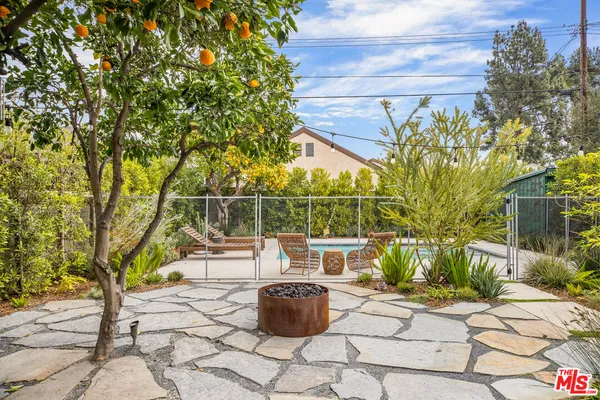 a view of a chairs and table in the patio