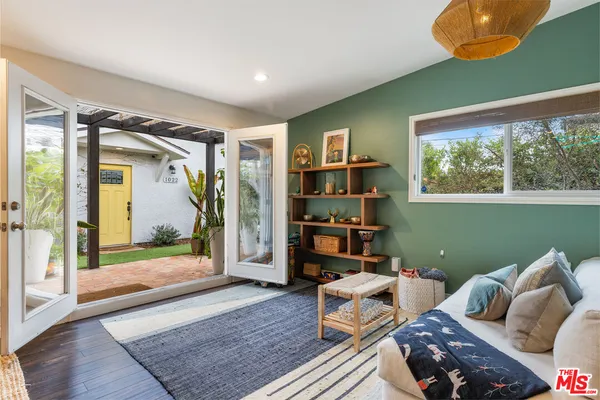 a living room with furniture and a rug