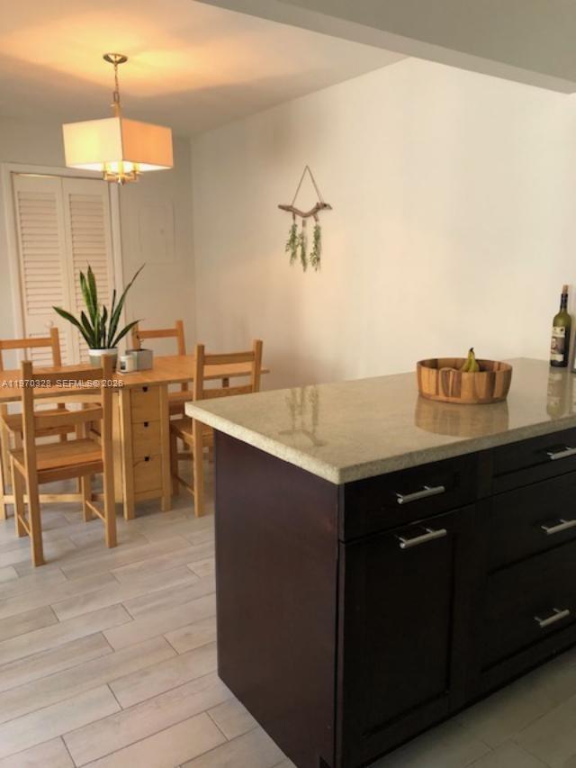 4724 Southwest 67th Avenue, Unit E10 Miami, FL 33155 - Photo 2 of 13 kitchen and dining area