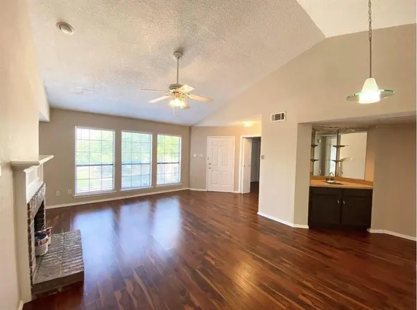 a spacious bathroom with a double vanity sink toilet and shower