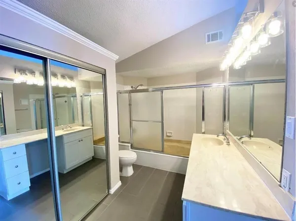 a room with a sink and a mirror