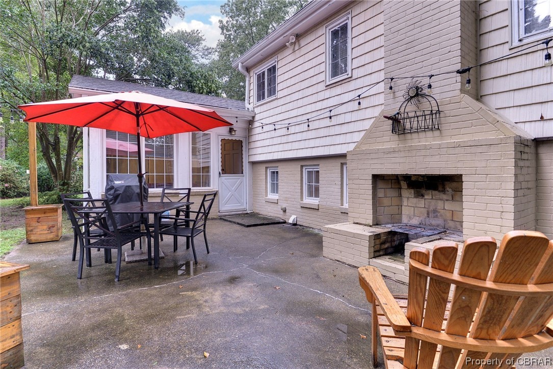 122 Selden Road Newport News, VA 23606 - Photo 24 of 38 View of patio with an outdoor fireplace