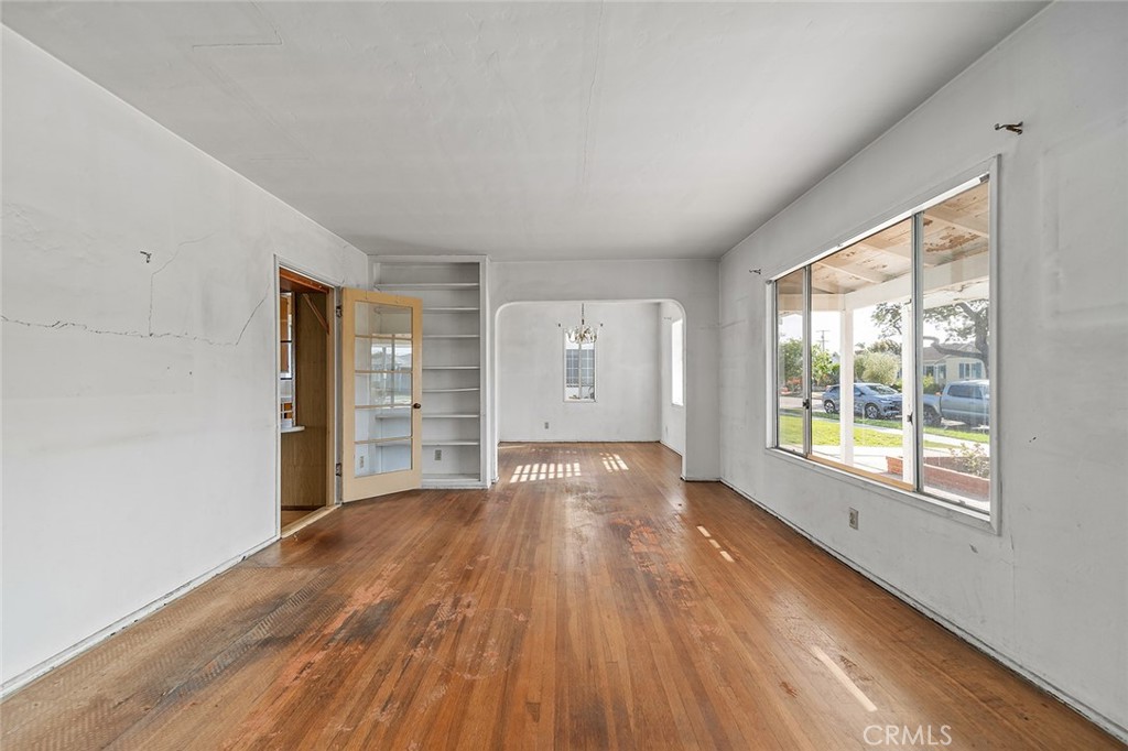 4224 Falcon Avenue Long Beach, CA 90807 - Photo 2 of 16 a view of an empty room with wooden floor and a window