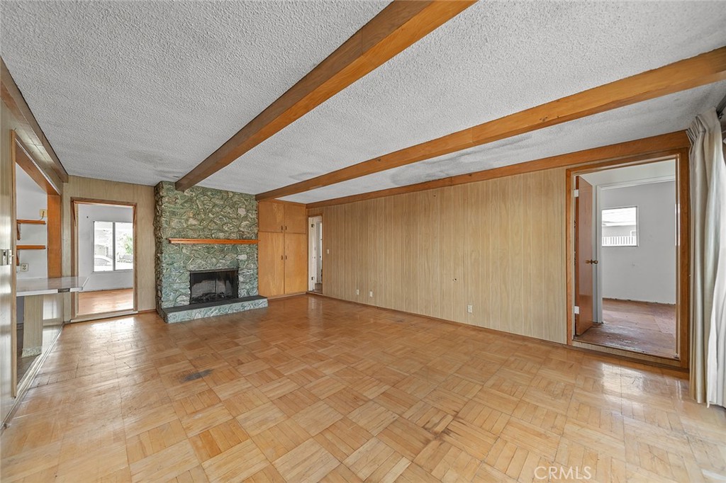 4224 Falcon Avenue Long Beach, CA 90807 - Photo 7 of 16 a view of empty room with a fireplace and fan
