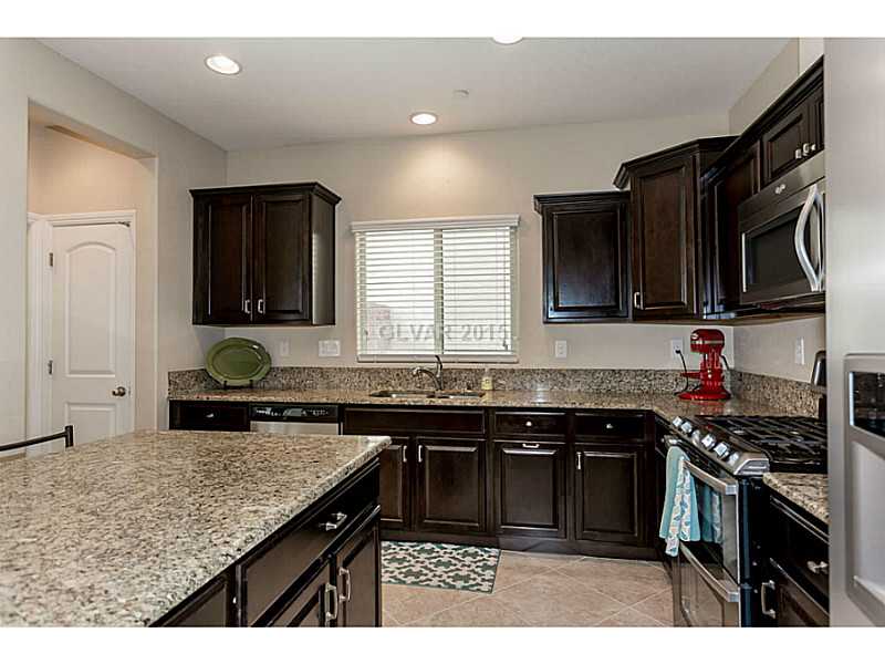 2337 Rue Royale Street Henderson, NV 89044 - Photo 13 of 35 Property Photo. Kitchen With Espresso Cabinets
