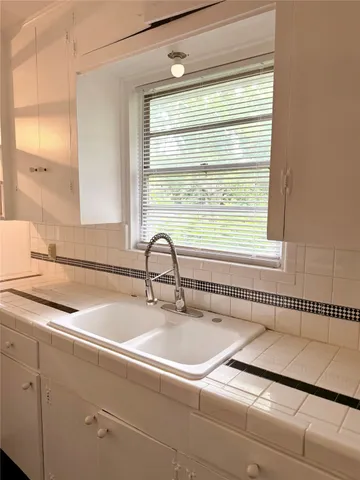 a bathroom with a sink and a bathtub