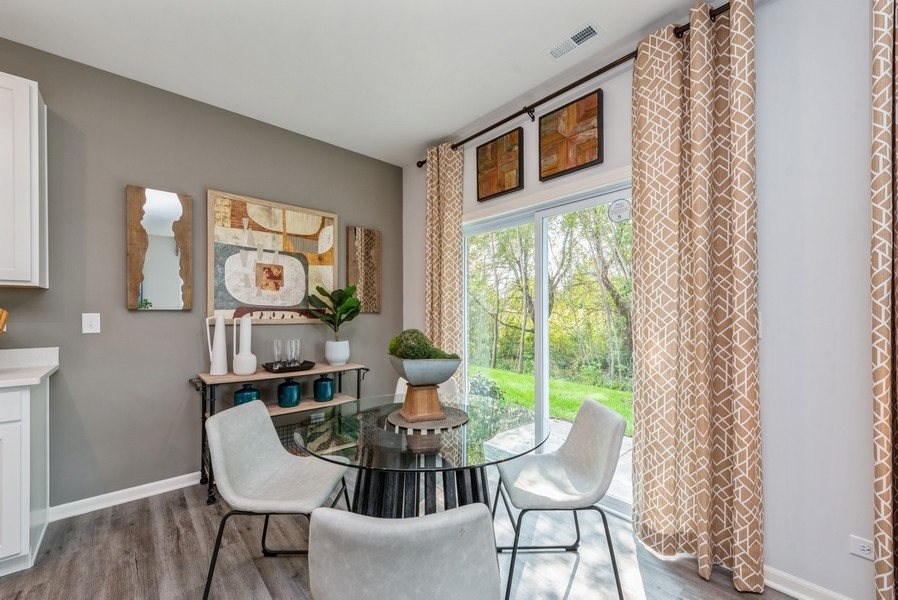 1245 Draper Road McHenry, IL 60050 - Photo 6 of 16 a view of a dining room with furniture window and outside view