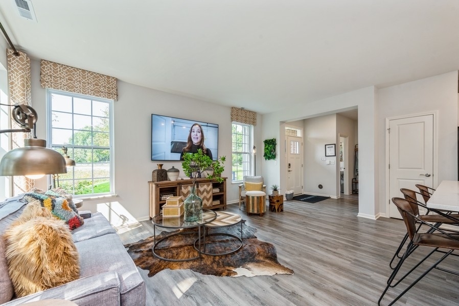 1245 Draper Road McHenry, IL 60050 - Photo 8 of 16 a living room with furniture and a wooden floor