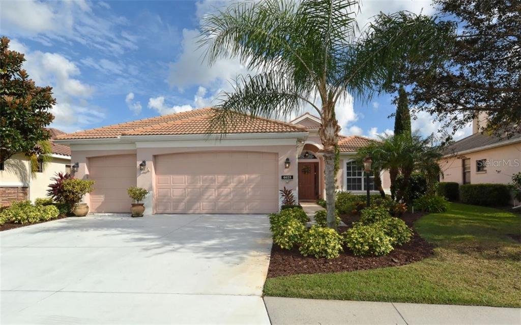 6623 Pirate Perch Trail Lakewood Ranch, FL 34202 - Photo 1 of 1 a front view of a house with a yard and garage