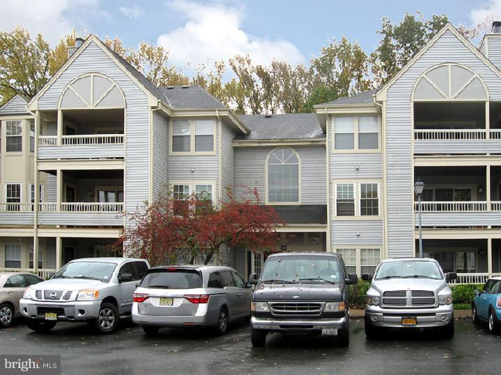 a view of a cars park in front of house