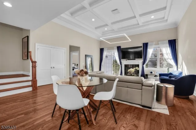 a spacious bedroom with a bed a mirror and lamp