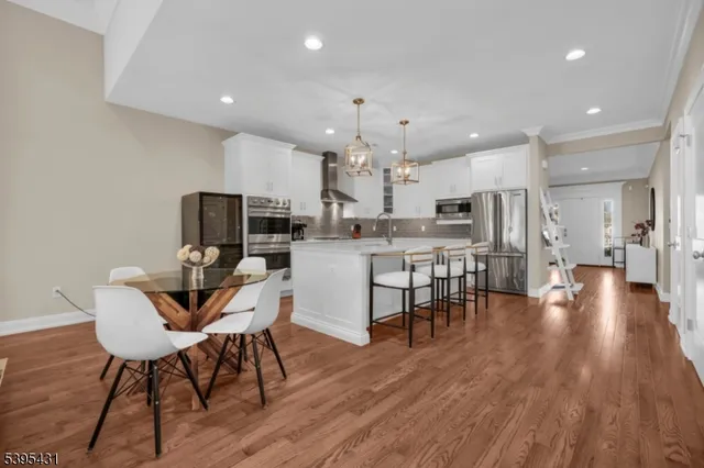 a spacious bathroom with a granite countertop sink a mirror and a shower