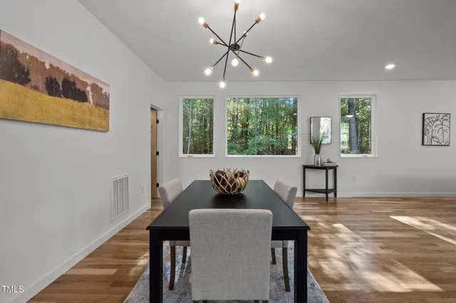a dining room with furniture and window