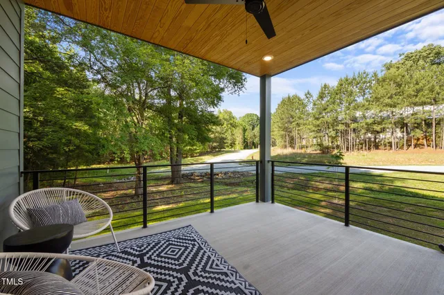 a balcony with view of an outdoor space