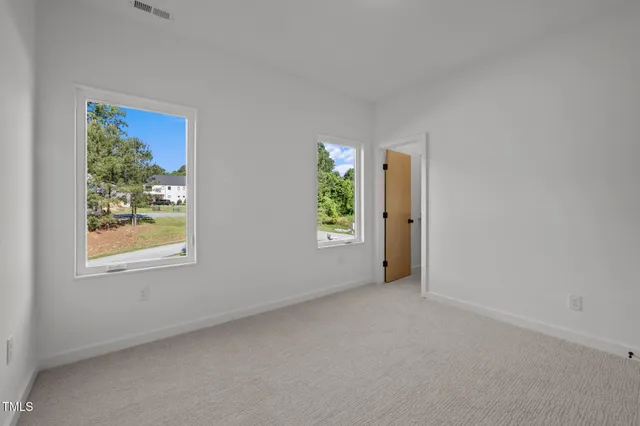 an empty room with windows