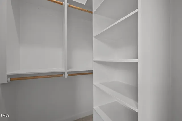 a view of an empty walk in closet