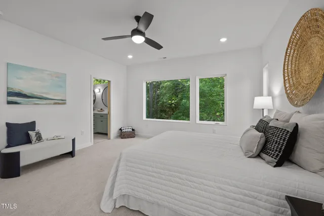 a bed room with a bed and a chair