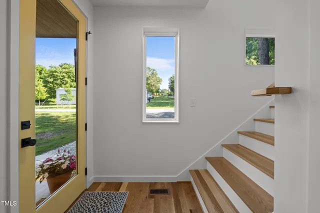a view of entryway with stairs and furniture