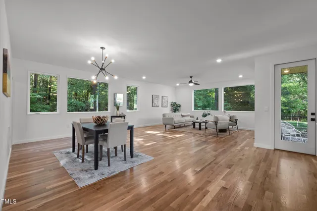 a view of a dining room with furniture window and wooden floor